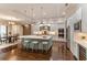Gourmet kitchen featuring a large island with stool seating, stainless appliances, and custom cabinetry at 4224 Clarice Estates Dr, Windermere, FL 34786