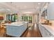 Open kitchen with large island, pendant lighting, and breakfast bar seating perfect for entertaining at 4224 Clarice Estates Dr, Windermere, FL 34786