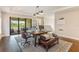 Large office with hardwood flooring, a large desk, and access to outdoor balcony at 4224 Clarice Estates Dr, Windermere, FL 34786