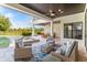 Expansive outdoor patio with seating area and view of the pool and landscaped backyard at 4224 Clarice Estates Dr, Windermere, FL 34786