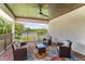 Inviting covered patio with outdoor seating and stunning lake view for relaxation and entertaining at 4224 Clarice Estates Dr, Windermere, FL 34786