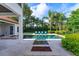 Beautiful outdoor swimming pool area with lounge chairs, integrated jacuzzi, and landscaping at 4224 Clarice Estates Dr, Windermere, FL 34786