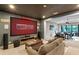 Home theater with large screen and comfortable seating that leads to an office space at 4224 Clarice Estates Dr, Windermere, FL 34786