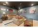 Home theater room with a large screen, comfortable seating, movie posters and themed decor at 4224 Clarice Estates Dr, Windermere, FL 34786