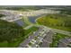 Aerial view of a Primary-planned community featuring lakes, roads, and green spaces at 4338 Finch Ln, Kissimmee, FL 34746