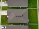 Overhead view of homes featuring well-maintained lawns and coordinated rooflines at 4338 Finch Ln, Kissimmee, FL 34746
