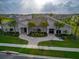 Community clubhouse with modern architectural design, well-kept landscaping, and inviting entrances at 4338 Finch Ln, Kissimmee, FL 34746