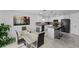 Open concept kitchen and dining area features white cabinets, stainless steel appliances and views to the dining area at 4338 Finch Ln, Kissimmee, FL 34746