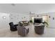 Bright living room features tiled flooring, neutral walls, ceiling fan and is filled with natural light at 4338 Finch Ln, Kissimmee, FL 34746