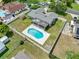 Aerial view of backyard and pool showing the home and fenced yard at 4607 Pine Lake Dr, St Cloud, FL 34769