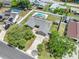 Aerial view of neighborhood property, featuring inground backyard pool and ample driveway at 4607 Pine Lake Dr, St Cloud, FL 34769