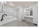 Bathroom with a double vanity, marble tile, walk-in shower, and modern lighting at 4607 Pine Lake Dr, St Cloud, FL 34769