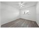 Bright bedroom featuring a ceiling fan, a window, and new floors at 4607 Pine Lake Dr, St Cloud, FL 34769