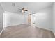 Bright bedroom with light grey flooring and stylish sliding barn door leading to the bathroom at 4607 Pine Lake Dr, St Cloud, FL 34769
