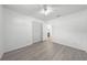 Bright bedroom features wood-look flooring, a ceiling fan and a closet at 4607 Pine Lake Dr, St Cloud, FL 34769