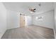 Bright bedroom with light grey flooring, ceiling fan, and stylish sliding barn door to closet at 4607 Pine Lake Dr, St Cloud, FL 34769