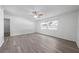 Spacious bedroom featuring a ceiling fan, large windows, and newly installed flooring at 4607 Pine Lake Dr, St Cloud, FL 34769