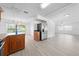 Open-concept kitchen features wood cabinets, stainless steel appliances, and seamless access to the dining and living areas at 4607 Pine Lake Dr, St Cloud, FL 34769