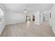Bright living room features wood-look flooring and an open layout into the kitchen at 4607 Pine Lake Dr, St Cloud, FL 34769
