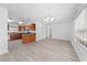 Spacious living room features modern flooring, a bar counter, and plenty of natural light at 4607 Pine Lake Dr, St Cloud, FL 34769