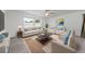 The living room features light colored walls, a light colored couch and two chairs at 4607 Pine Lake Dr, St Cloud, FL 34769