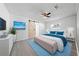Stylish bedroom features a barn door, television, and modern decor at 4607 Pine Lake Dr, St Cloud, FL 34769