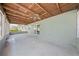 Screened patio featuring a wood ceiling and a view of the backyard at 4607 Pine Lake Dr, St Cloud, FL 34769