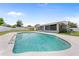 Inviting backyard pool with covered, screened in lanai area and a fenced in yard at 4607 Pine Lake Dr, St Cloud, FL 34769