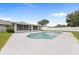 Backyard swimming pool with concrete deck at 4607 Pine Lake Dr, St Cloud, FL 34769