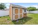 Exterior view of a backyard shed with double doors at 4607 Pine Lake Dr, St Cloud, FL 34769