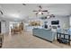 Open-concept living room with tile floors and a seamless flow to the kitchen at 6396 Bennett Ct, St Cloud, FL 34771