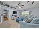 Cozy living room featuring neutral tones, vaulted ceilings, and natural light at 6396 Bennett Ct, St Cloud, FL 34771