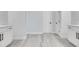 Spacious bathroom with double vanities, modern fixtures, and sleek gray flooring at 7 Spring Pass, Ocala, FL 34472