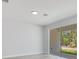 Bright living room with sliding glass doors overlooking the backyard, providing ample natural light at 7 Spring Pass, Ocala, FL 34472