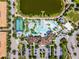 Aerial view of the community center, pool, lazy river, basketball court, and lake at 8897 Rhodes St, Kissimmee, FL 34747