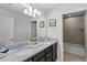 Bathroom featuring double sinks with granite countertops and a shower and tub combo at 8897 Rhodes St, Kissimmee, FL 34747