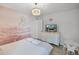 Whimsical bedroom with castle mural, TV, and kid-sized table and chairs at 8897 Rhodes St, Kissimmee, FL 34747