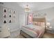 Charming bedroom featuring themed artwork, stylish chandelier, and plush bedding at 8897 Rhodes St, Kissimmee, FL 34747