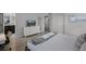 Comfortable bedroom with a TV, dresser, and soft, neutral tones for a relaxing vacation at 8897 Rhodes St, Kissimmee, FL 34747