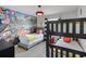 Charming ' bedroom with two beds and fun race car-themed decor for a playful and inviting space at 8897 Rhodes St, Kissimmee, FL 34747