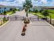 Gated community entrance with secure access and landscaped surroundings at 8897 Rhodes St, Kissimmee, FL 34747