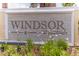 Entrance sign for Windsor at Westside surrounded by lush landscaping at 8897 Rhodes St, Kissimmee, FL 34747