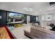 Recreation room featuring a large projector screen, shuffleboard table, and comfortable seating at 8897 Rhodes St, Kissimmee, FL 34747