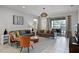 Inviting living room with stylish furnishings, tile flooring, and sliding glass doors leading to an outdoor patio at 8897 Rhodes St, Kissimmee, FL 34747