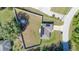 Aerial view of home featuring large fenced yard and solar panels on the roof at 10 Pine Track Trl, Ocala, FL 34472