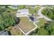 Aerial view of the home showing the large fenced-in backyard, solar panels, and the surrounding neighborhood at 10 Pine Track Trl, Ocala, FL 34472
