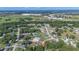 Aerial view of a quiet neighborhood featuring mature trees at 10 Pine Track Trl, Ocala, FL 34472