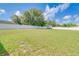 Spacious backyard featuring a white fence and storage shed at 10 Pine Track Trl, Ocala, FL 34472