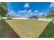 Spacious backyard featuring a white fence and storage shed at 10 Pine Track Trl, Ocala, FL 34472
