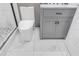 Contemporary bathroom showcasing marble-look floors and gray vanity with modern fixtures at 10 Pine Track Trl, Ocala, FL 34472